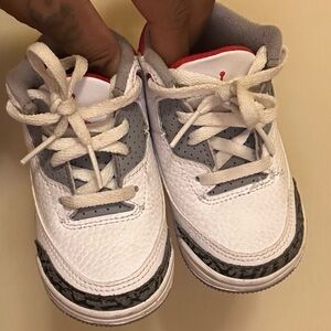 White and Gray Sneakers with Red Accents